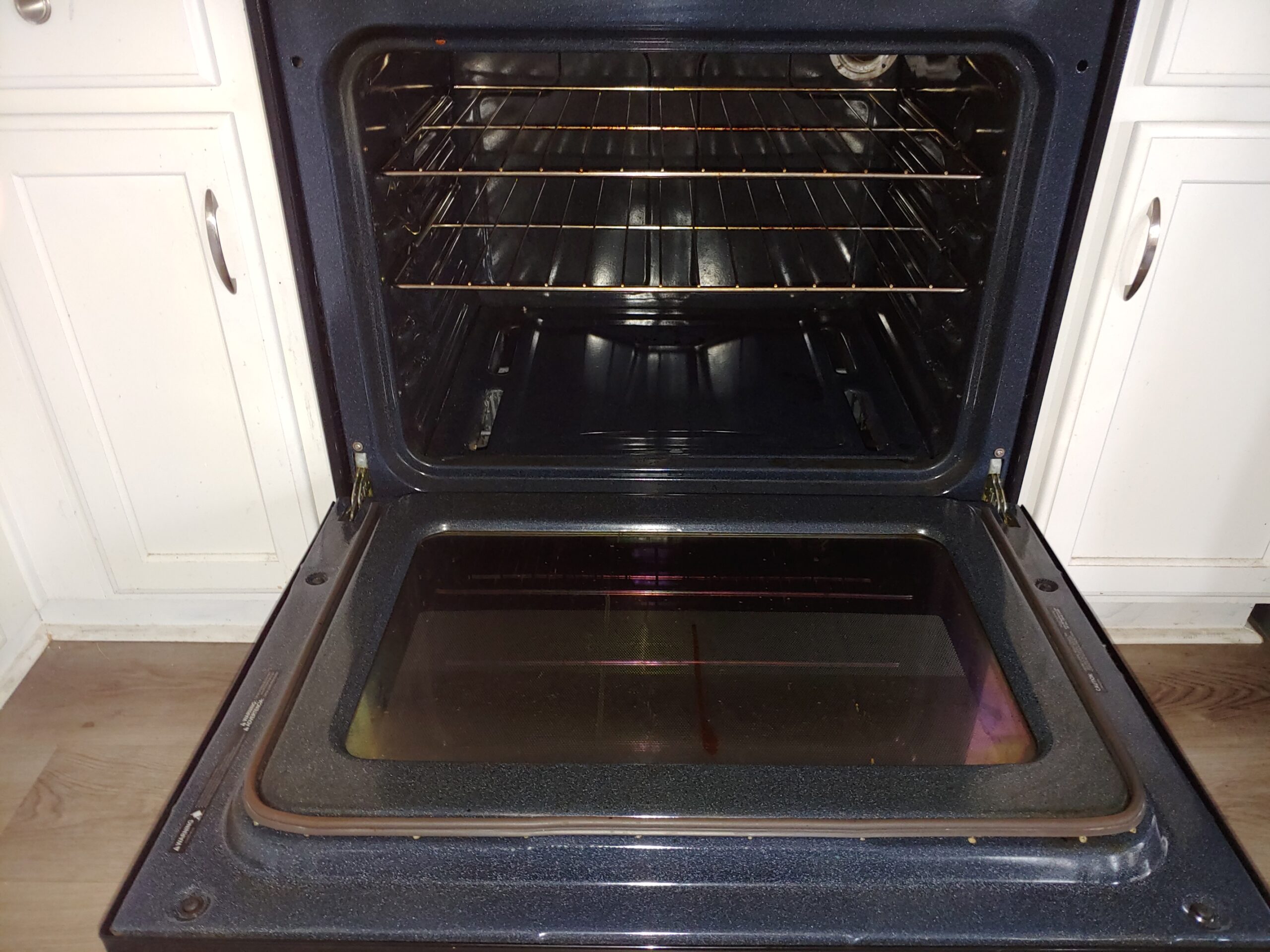 This image conveys the effect of hiring Mean Green Cleaning's oven cleaning service. Picture shows a spotless oven with slight wear and tear in Green Valley, AZ.